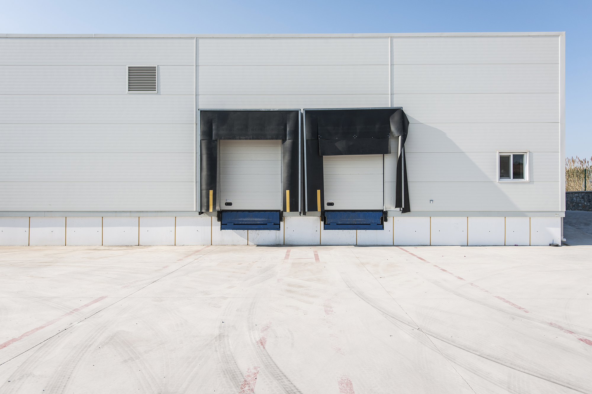 Cold storage DC loading bay with trailer at dock
